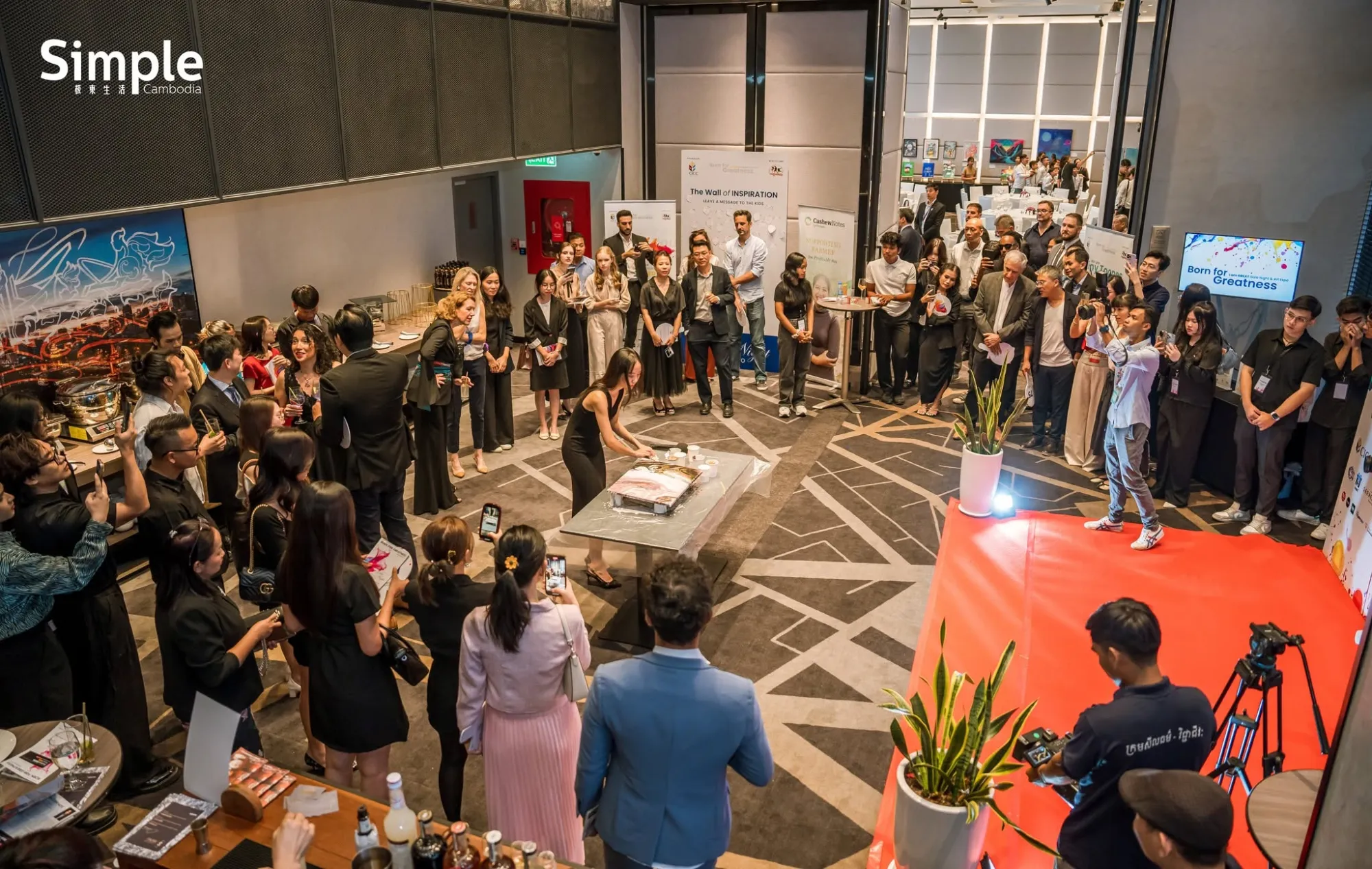 Gala night guests gathered around a live painting